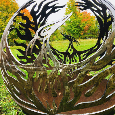Phoenix Pattern Steel Fire Pit Outdoor Patio Corten Sphere Firepit Untuk Pemanasan Taman
